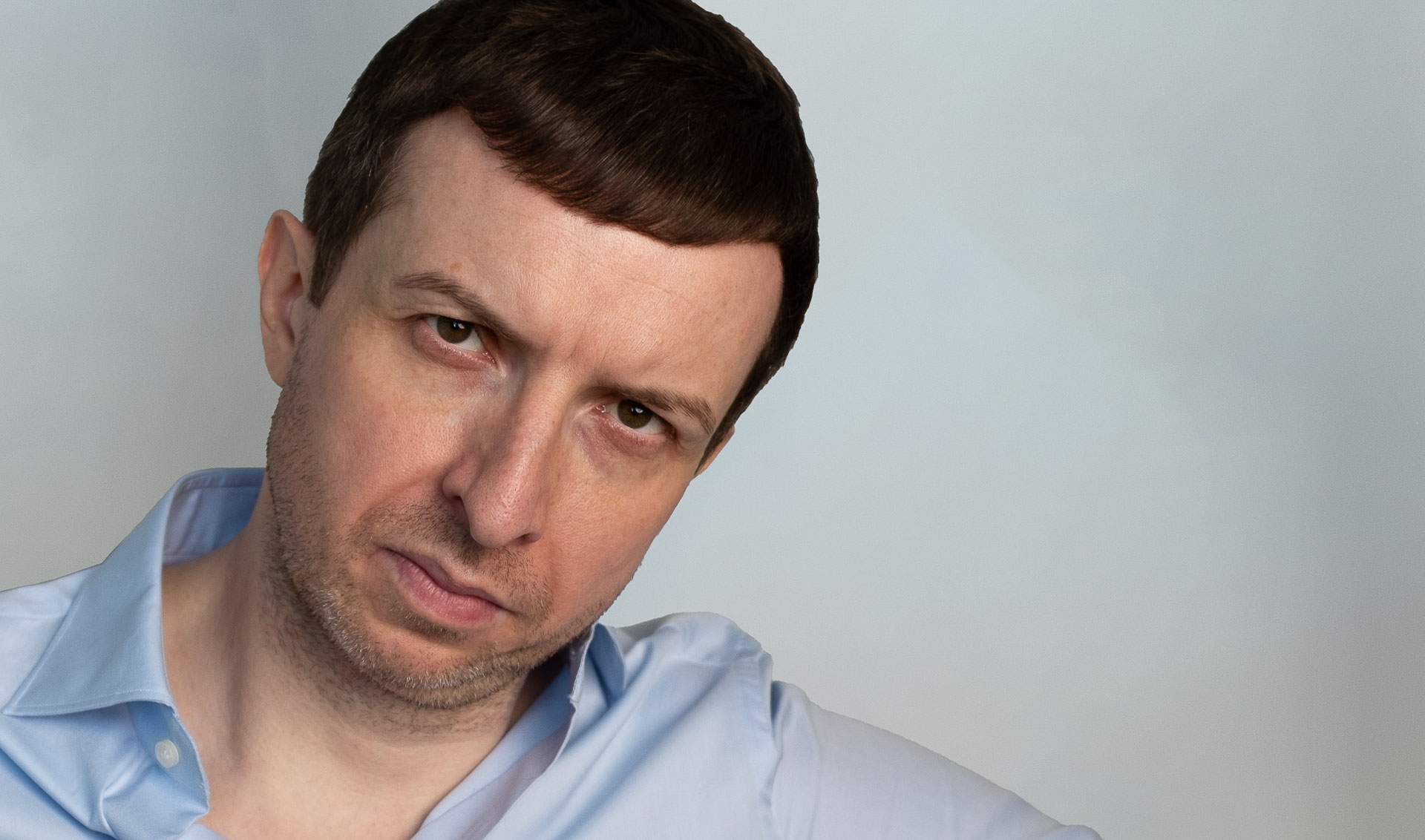 Headshot of Michael Serwa, accountability coach, conveying disciplined focus and accountability through a direct, intense gaze.